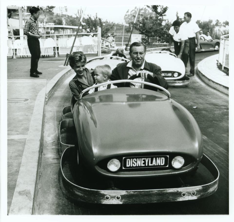 Walt Disney, daughter Diane Disney Miller, and grandson Christopher Miller ride in an Autopia car at Disneyland in 1957. The Walt Disney Foundation is opening a museum dedicated to the life of Walt Disney later this fall in San Francisco's Presidio.