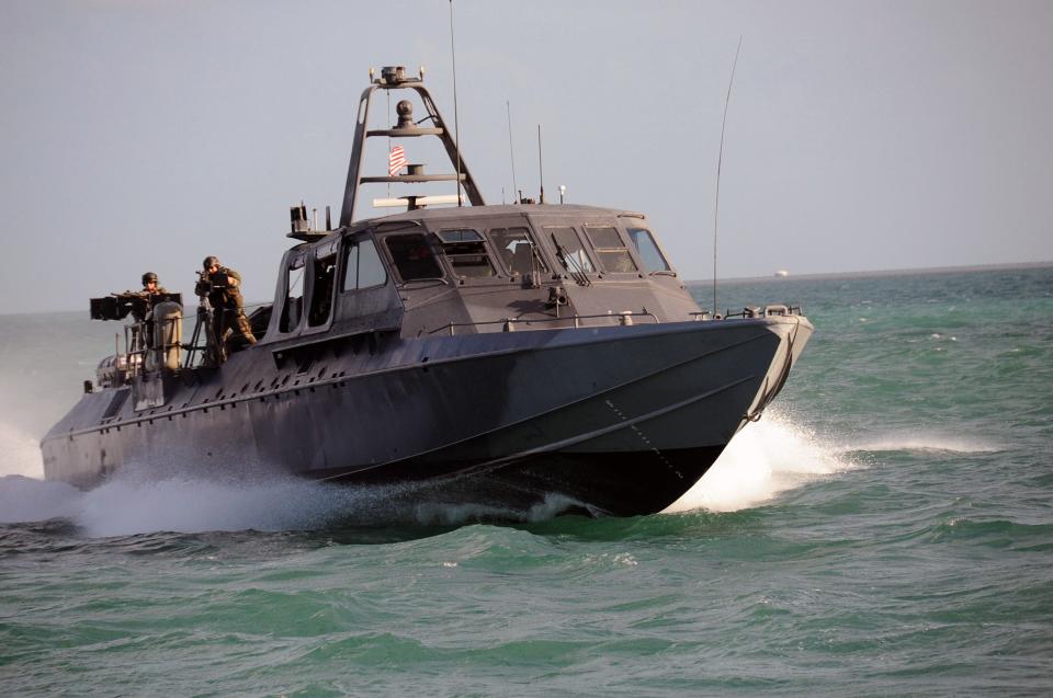 A Special Warfare Combatant-Craft Crewman (SWCC) assigned to Special Boat Team (SBT) 20 navigates the MARK V Special Operations Craft for a scene in the upcoming Bandito Brothers production 2009